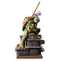 Iron Studios Donatello 1/10 scale statue in a dynamic pose on a detailed industrial base with his signature bo staff.