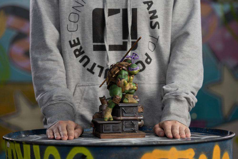 Iron Studios 1/10 scale Donatello statue featuring the turtle in a combat pose on a detailed industrial base.