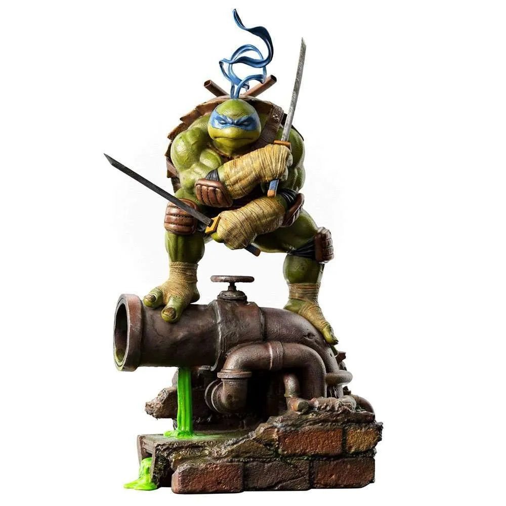 Iron Studios 1/10 scale Leonardo statue featuring the turtle in a combat pose atop a rusted pipe with green ooze.
