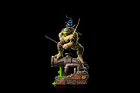 Iron Studios Leonardo 1/10 scale statue in a dynamic pose, wielding katanas atop a brick and pipe sewer base.