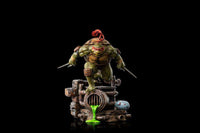 Iron Studios Raphael 1/10 scale statue in a dynamic pose, featuring green skin, red mask, and sai weapons on a sewer base.