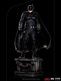 Iron Studios The Batman 1/10 scale statue featuring the hero in a detailed black tactical suit on a display base.