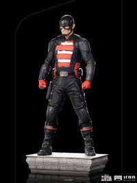 John Walker U.S. Agent 1/10 scale statue by Iron Studios in a black and red tactical suit standing on a stone base.