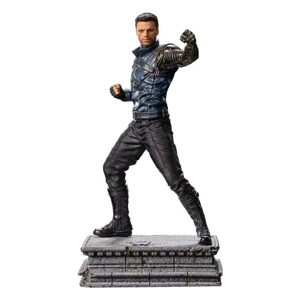 Iron Studios Bucky Barnes 1/10 scale statue in a dynamic fighting pose on a stone base, side view.