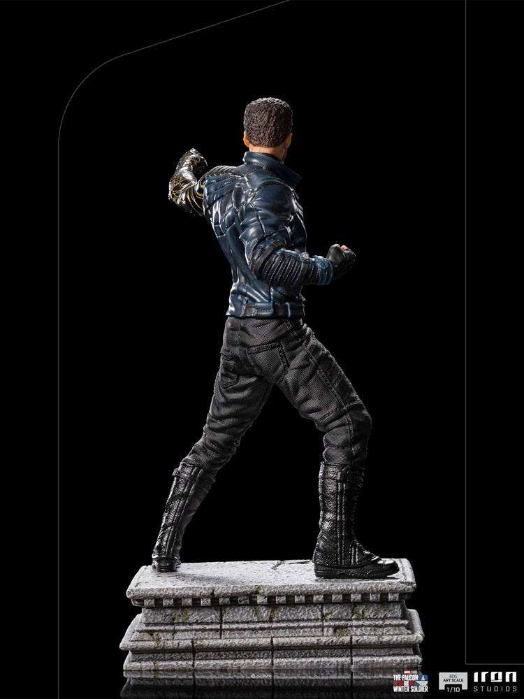 Rear view of Iron Studios Bucky Barnes 1/10 scale statue, featuring his metallic arm and tactical suit on a stone base.