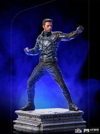 Iron Studios Bucky Barnes 1/10 scale statue in a combat pose, featuring a metallic arm and dark tactical suit on a base.