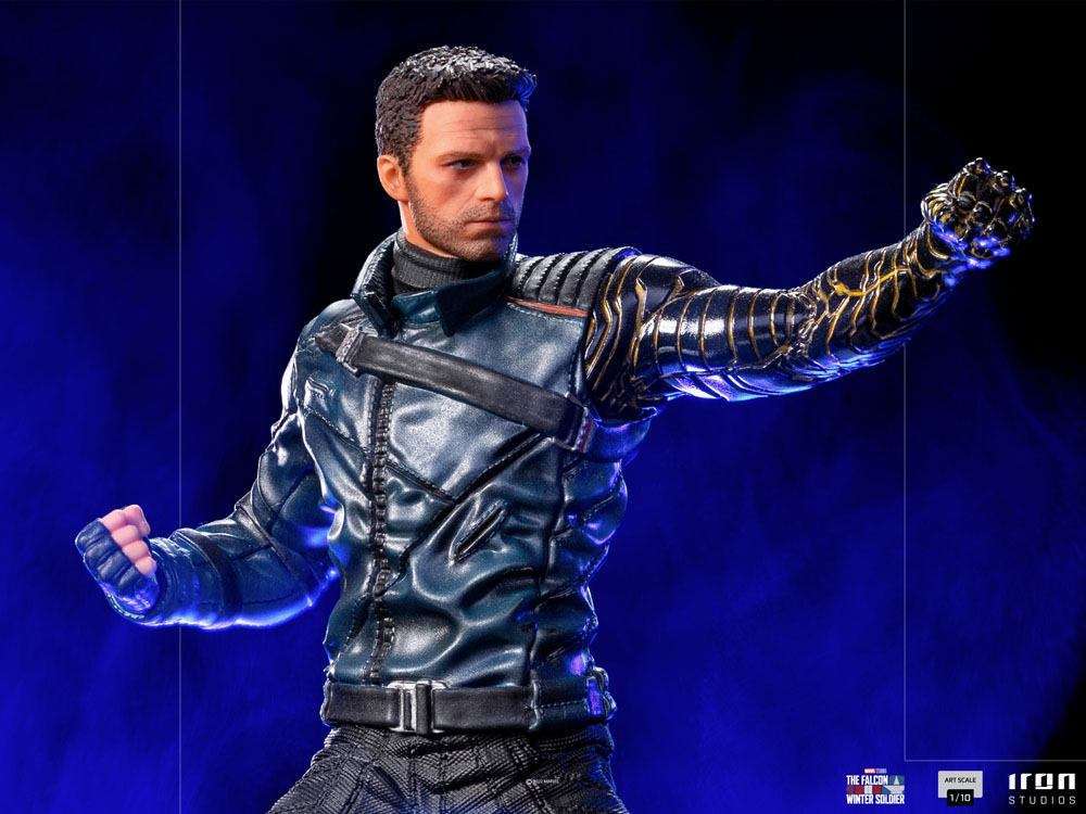 Iron Studios Bucky Barnes 1/10 scale statue featuring a detailed metallic arm and blue jacket in a dynamic pose.