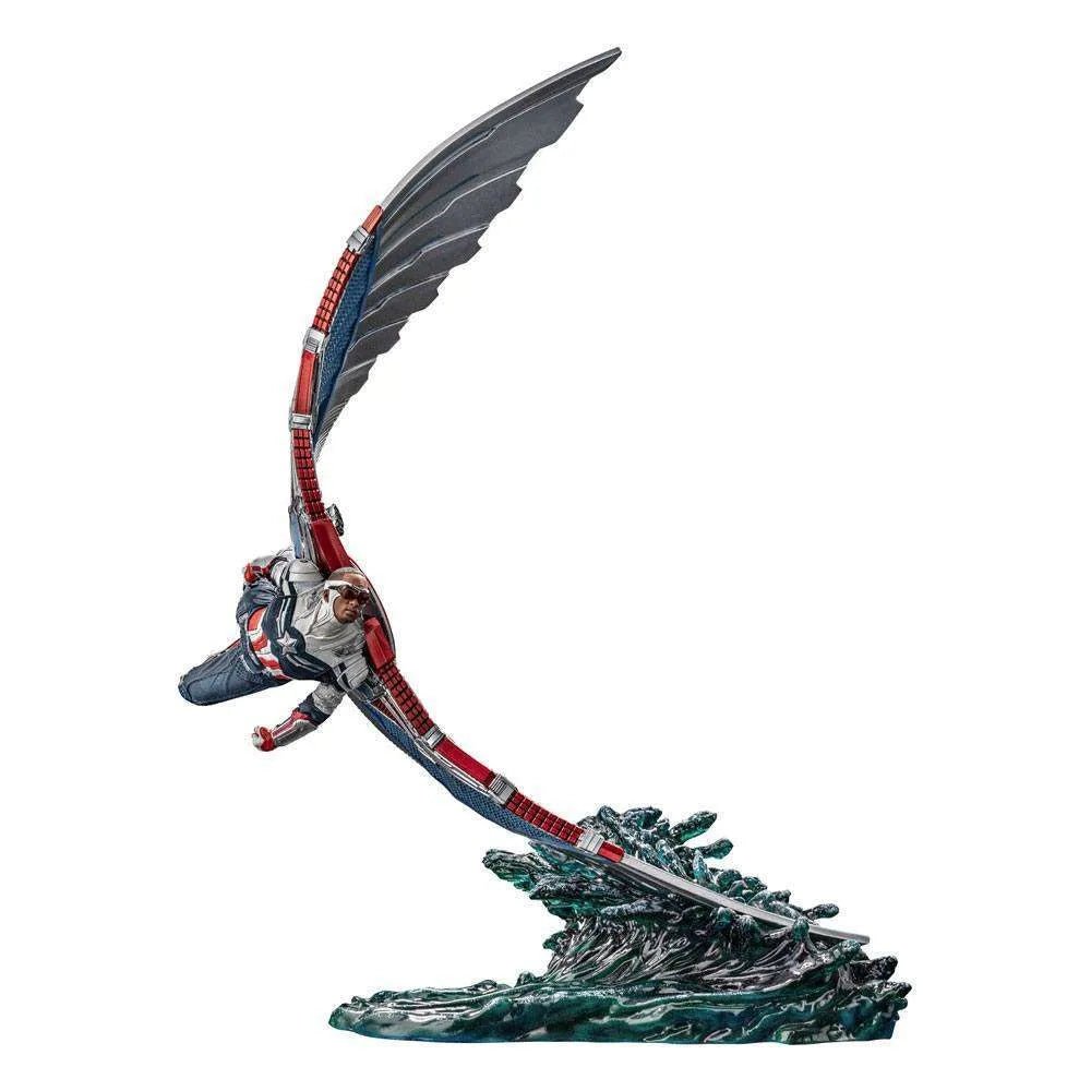 Iron Studios Sam Wilson Captain America statue in flight, featuring detailed red, white, and blue wings over a water base.