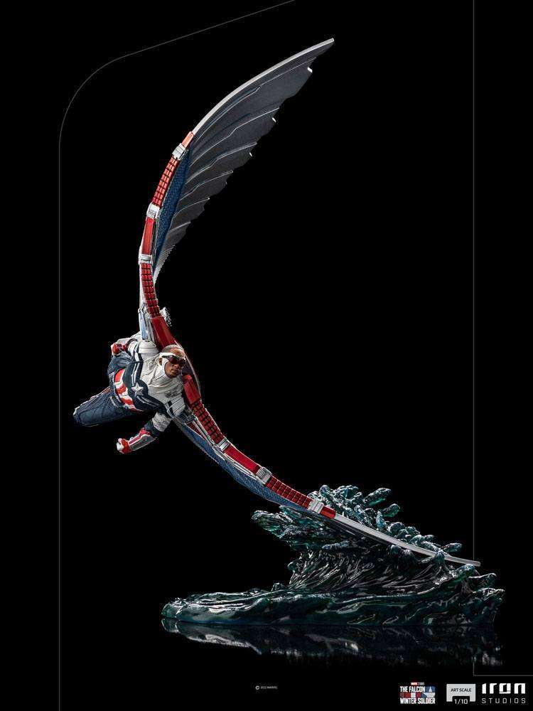 Iron Studios Sam Wilson Captain America 1/10 statue in a dynamic flying pose with wings extended over a water base.