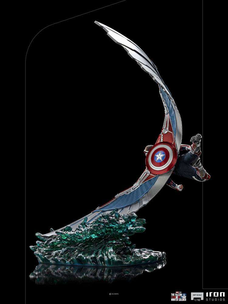 Side view of Iron Studios Captain America Sam Wilson 1/10 statue with metallic wings and shield on a water base.