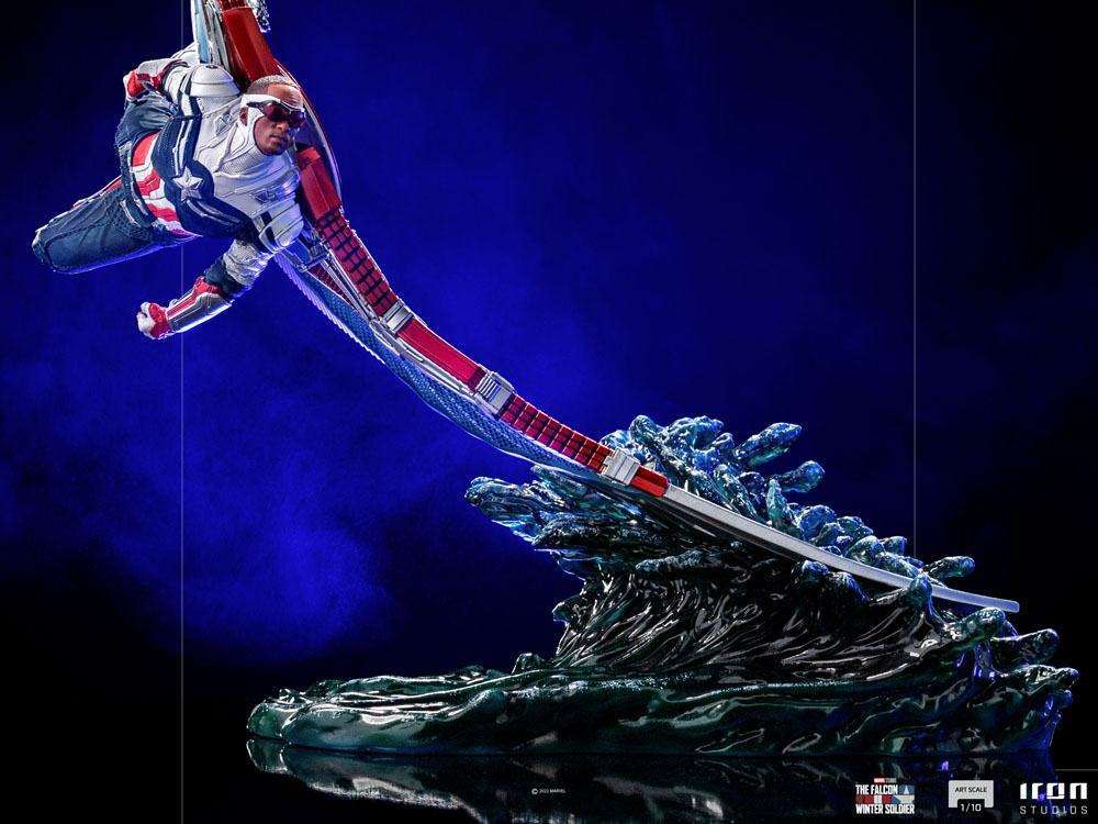 Iron Studios Sam Wilson Captain America 1/10 scale statue in a dynamic flying pose over a translucent water base.
