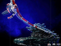 Iron Studios Sam Wilson Captain America 1/10 scale statue in a dynamic flying pose over a translucent water base.