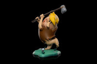 Iron Studios 1/10 scale Barney Rubble statue swinging a stone club on a green base against a black background.