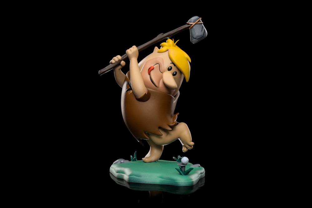 Iron Studios 15 cm Barney Rubble statue in a side view, swinging a stone club on a green base against a black background.