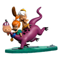 Iron Studios 1/10 scale statue of Dino, Pebbles, and Bamm-Bamm, featuring the colorful characters on a green base.