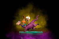 Iron Studios 1/10 scale statue of Dino, Pebbles, and Bamm-Bamm, featuring the colorful characters on a green base.