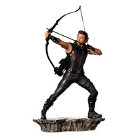 Iron Studios 1/10 Hawkeye Battle of NY statue in a dynamic archery pose on a rocky base, side view.