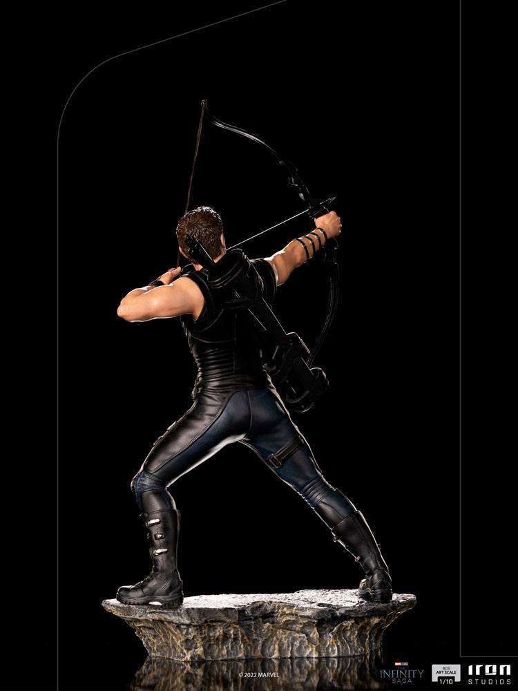 Back view of Iron Studios Hawkeye 1/10 scale statue aiming a bow while standing on a rocky Battle of NY base.