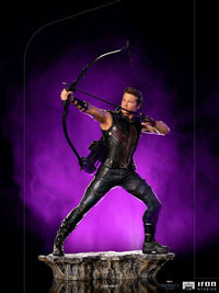 Iron Studios Hawkeye 1/10 scale statue in a dynamic archery pose, wearing a tactical suit on a rocky base.