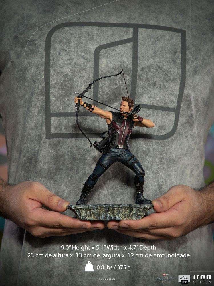 Iron Studios 1/10 Hawkeye Battle of NY statue in a dynamic archery pose, held in hands against a grey background.