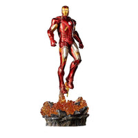 Iron Studios 1/10 Iron Man Battle of NY statue in red and gold armor, hovering above a rocky, fiery display base.
