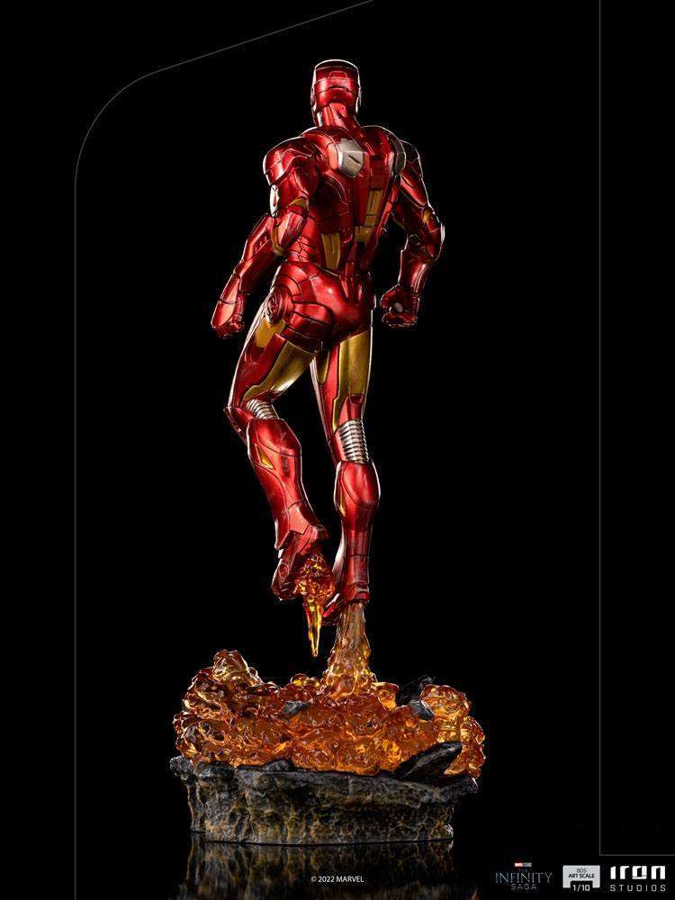 Rear view of Iron Studios Iron Man Battle of NY 1/10 scale statue in red and gold armor with a fiery base.
