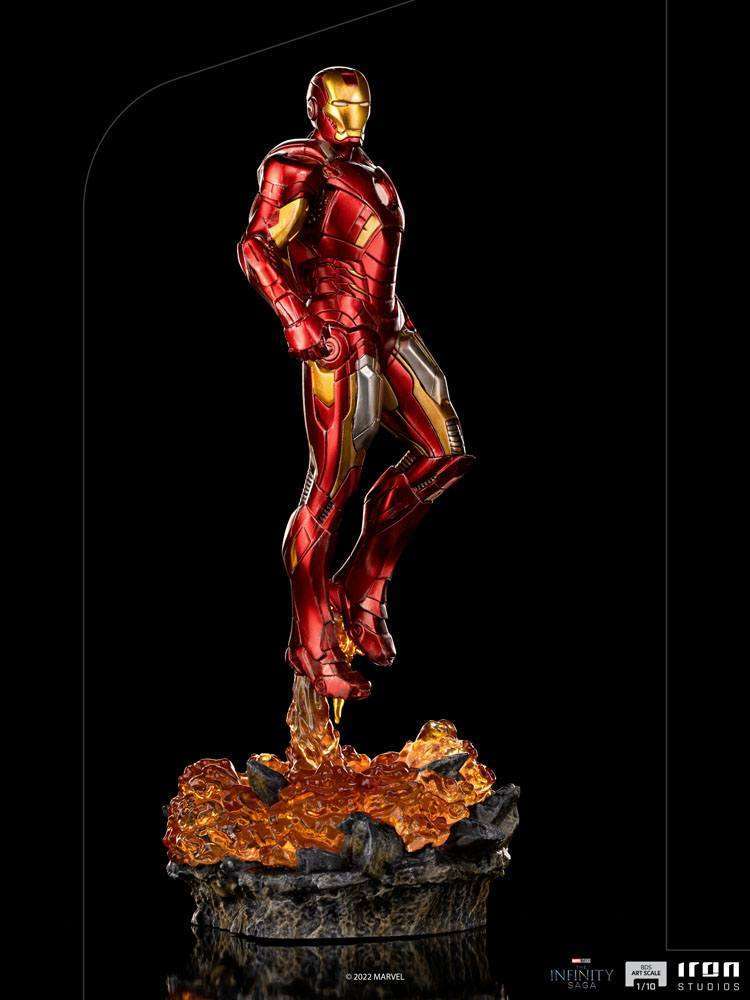 Side view of Iron Studios Iron Man Battle of NY 1/10 scale statue in red and gold armor hovering over a fiery base.