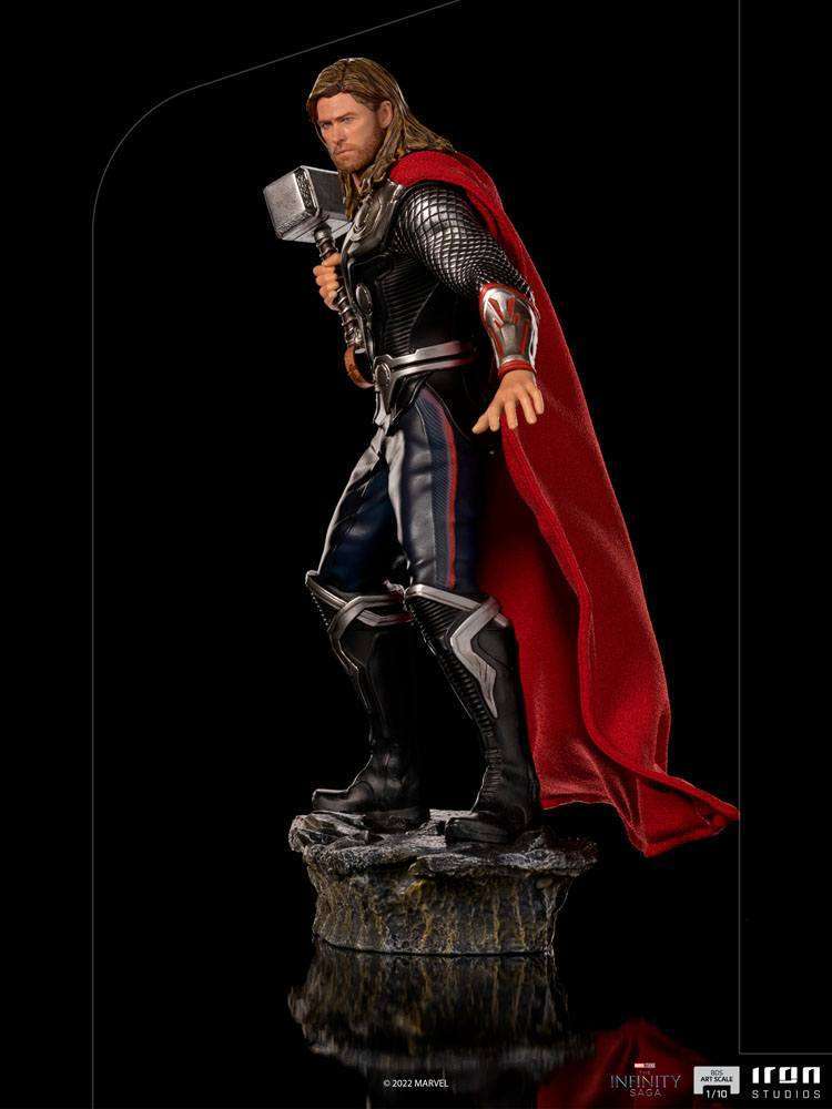 Iron Studios 1/10 Thor Battle of NY statue showing a side profile of the hero with Mjolnir and a flowing red cape.
