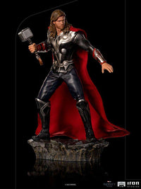 Iron Studios 1/10 Thor Battle of NY statue featuring a detailed metallic armor, red cape, and Mjolnir on a rocky base.