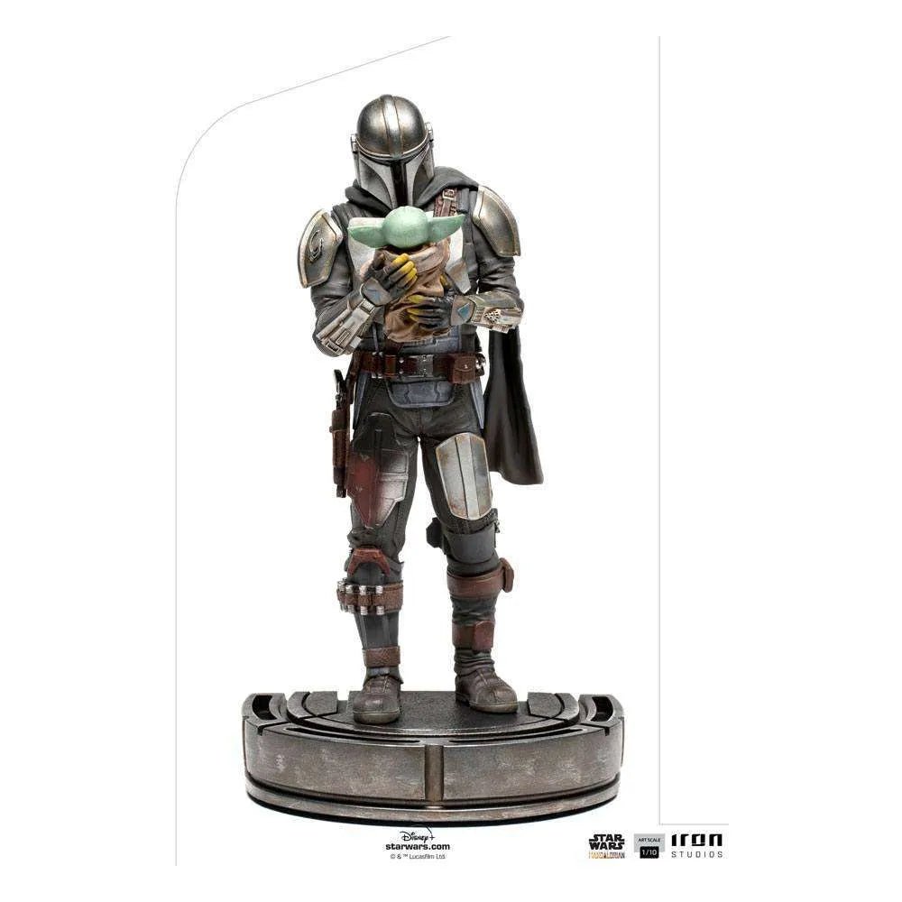 Iron Studios 1/10 scale Mandalorian and Grogu statue showing the armored bounty hunter holding the child on a base.
