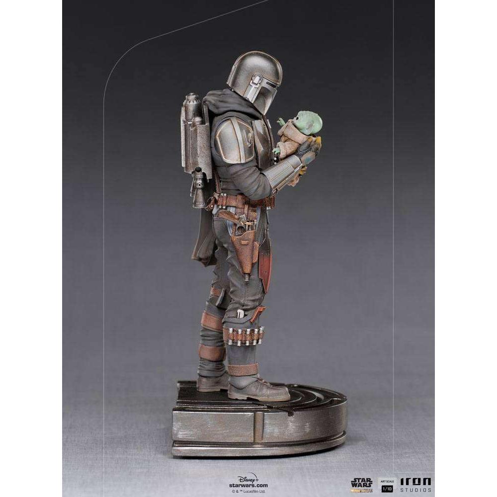 Side view of Iron Studios 1/10 Mandalorian and Grogu statue featuring detailed metallic armor and fabric textures.