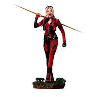 Iron Studios 1/10 Harley Quinn statue from The Suicide Squad, featuring her in a red and black outfit holding a spear.