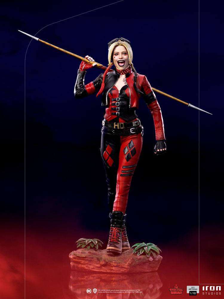 Iron Studios 1/10 Harley Quinn BDS Art Scale statue in a red and black leather outfit, holding a spear on her shoulders.