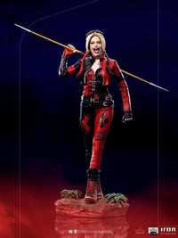 Iron Studios 1/10 Harley Quinn BDS Art Scale statue in a red and black leather outfit, holding a spear on her shoulders.