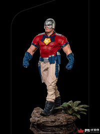 Iron Studios 1/10 Peacemaker statue from The Suicide Squad, featuring a silver helmet and red and tan tactical suit.