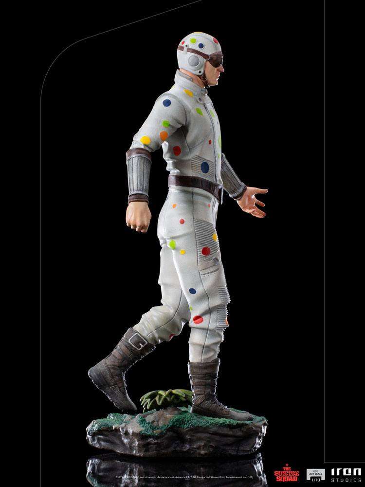 Side view of Iron Studios Polka-Dot Man 1/10 scale statue featuring a white suit with colorful dots on a rocky base.