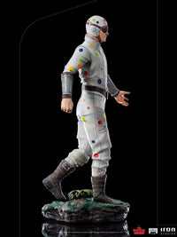 Side view of Iron Studios Polka-Dot Man 1/10 scale statue featuring a white suit with colorful dots on a rocky base.