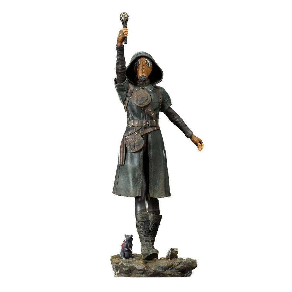 Iron Studios Ratcatcher II 1/10 scale statue in a dark hooded coat, gas mask, and holding a baton, standing on a base.