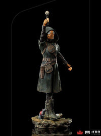 Iron Studios Ratcatcher II 1/10 scale statue in a dark coat and gas mask, holding a glowing device on a rocky base.