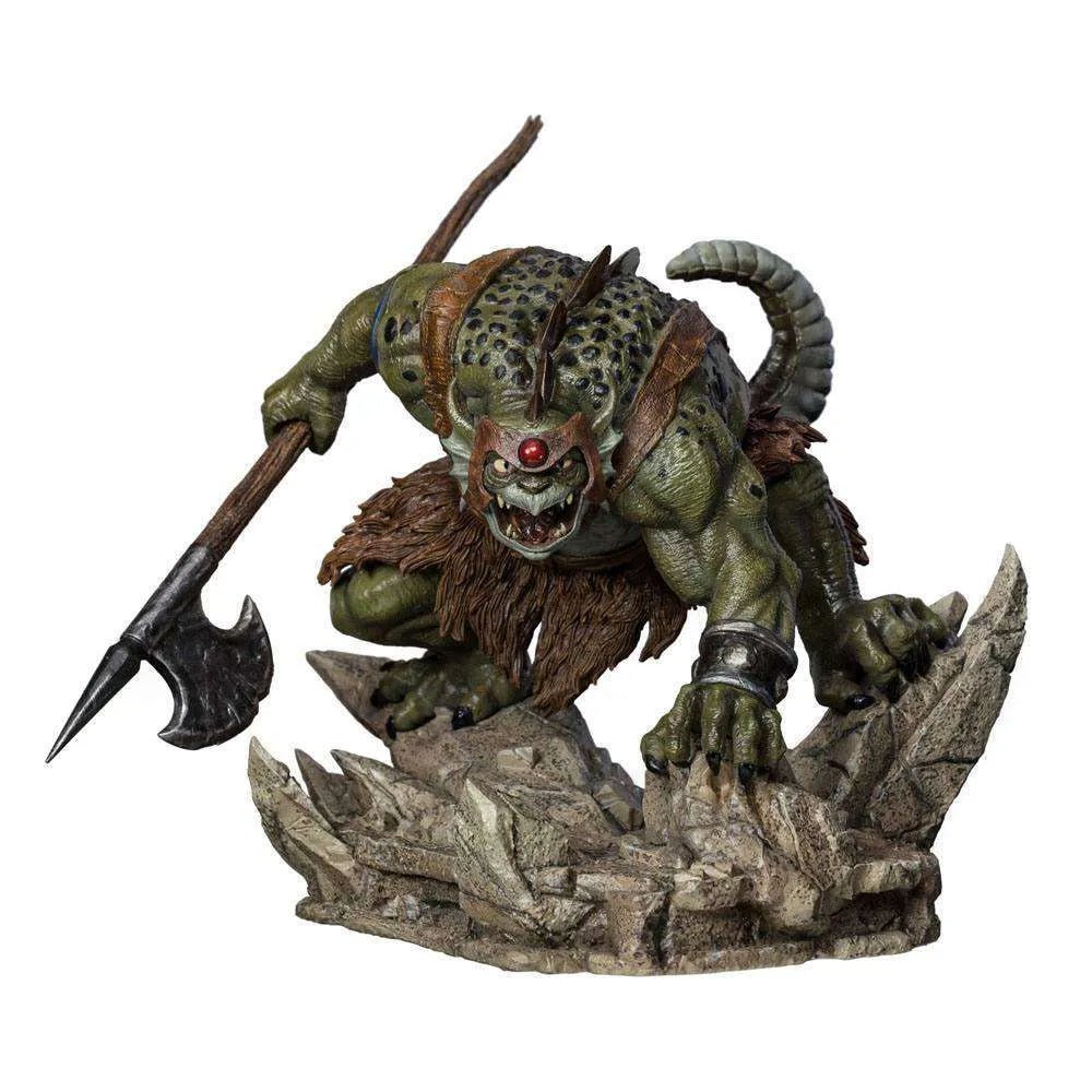 Iron Studios Slithe 1/10 scale statue in a crouching pose, featuring green reptilian skin, fur loincloth, and battle axe.