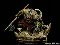 Iron Studios Slithe 1/10 scale statue featuring the green reptilian villain holding an axe on a rocky base.