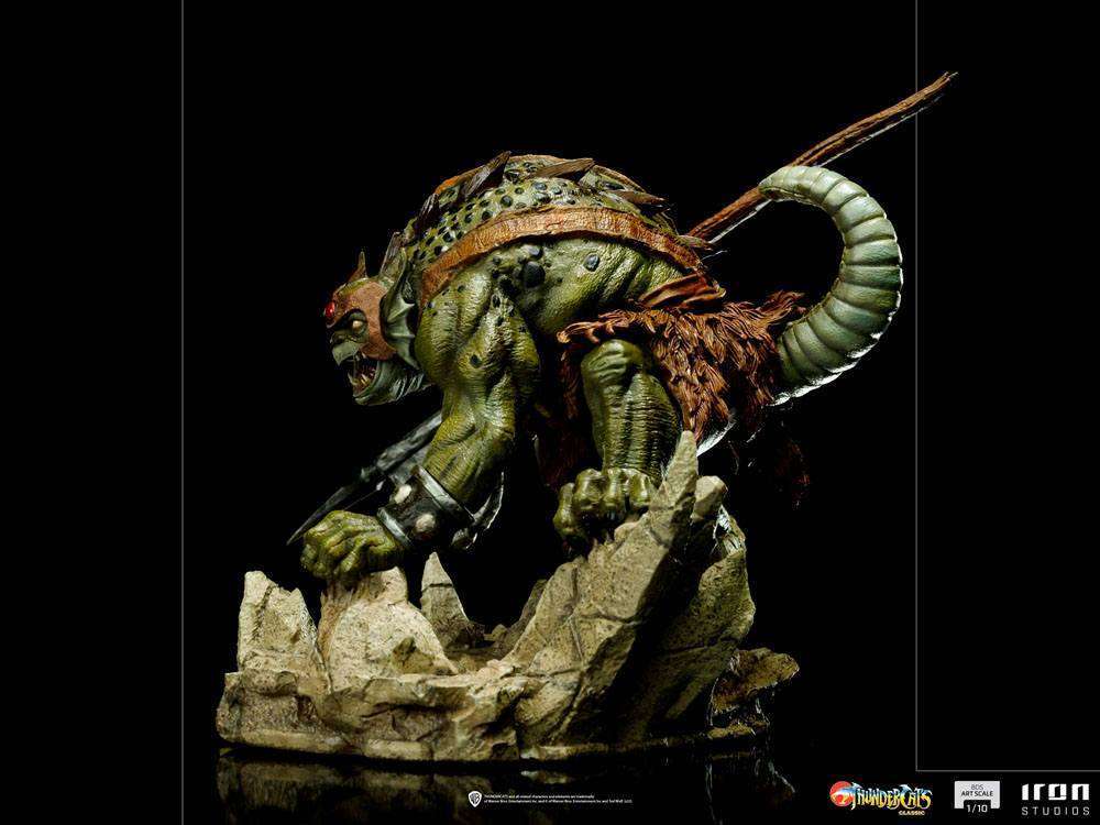 Side view of the 17 cm Iron Studios Slithe BDS Art Scale statue, featuring the green reptilian villain on a base.