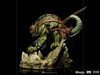 Side view of the 17 cm Iron Studios Slithe BDS Art Scale statue, featuring the green reptilian villain on a base.
