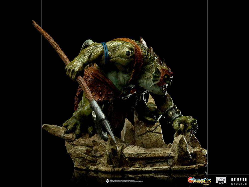 Side view of the 17 cm Iron Studios Slithe BDS Art Scale statue, featuring the green reptilian warrior with a spear.