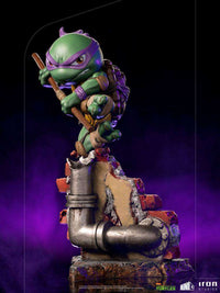 Donatello Iron Studios Mini Co. PVC figure in a dynamic pose with his bo staff atop a detailed brick and pipe base.