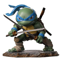 Iron Studios Leonardo TMNT Mini Co. PVC figure in a dynamic fighting pose with dual katanas on a stone base.