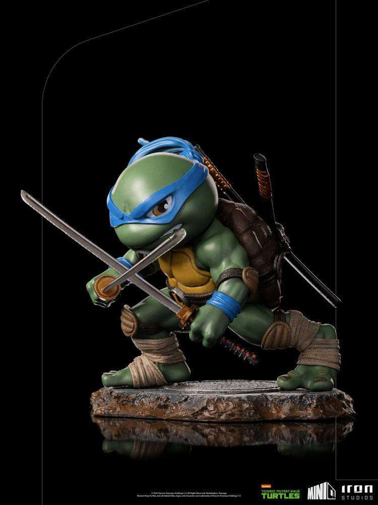 Iron Studios Leonardo Mini Co. PVC figure in a dynamic combat pose with dual katanas on a textured rocky base.