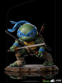 Iron Studios Leonardo Mini Co. PVC figure in a dynamic fighting pose with dual katanas on a textured rocky base.