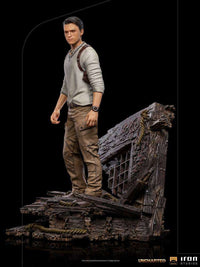 Iron Studios 1/10 Nathan Drake statue from the Uncharted movie, featuring a detailed figure on a shipwreck base.
