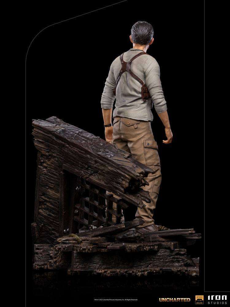 Back view of the 22cm Iron Studios Uncharted Nathan Drake statue standing on a detailed wooden shipwreck base.